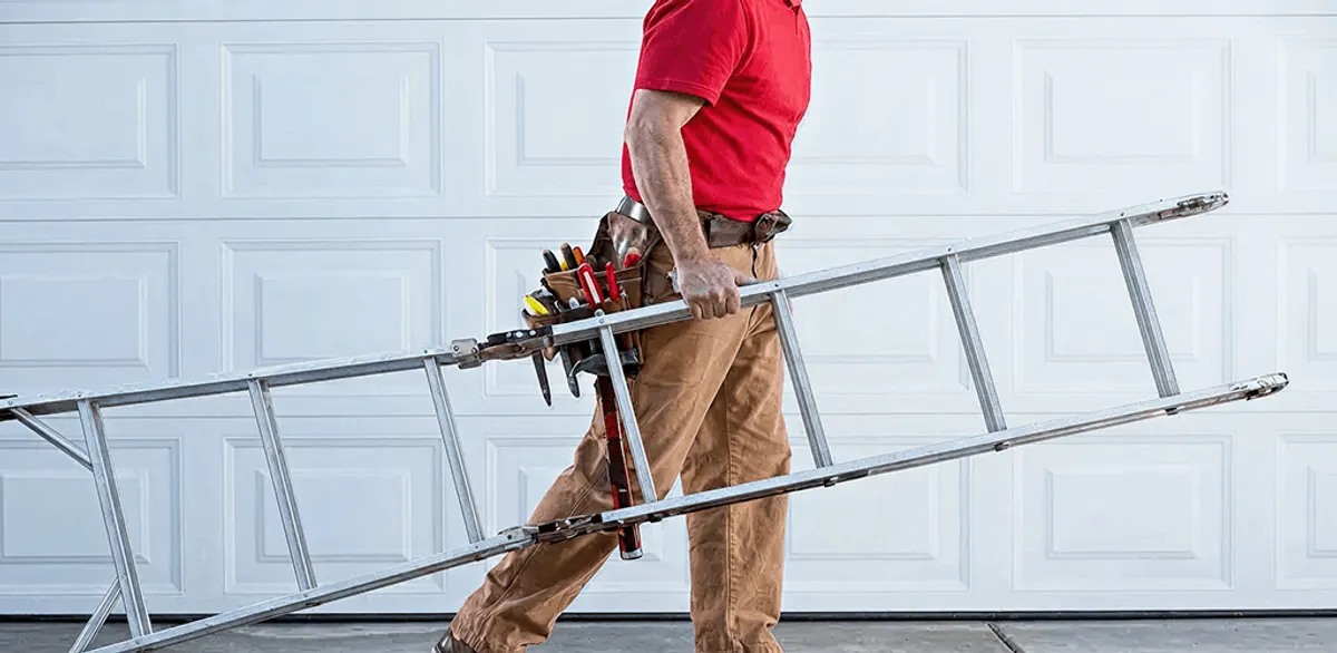 Garage door repair technician arriving with tools and ladder in Salt Lake City, UT